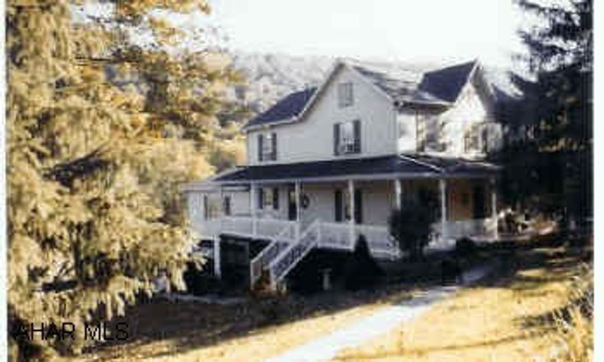 Large 2-story home on 5+ acres. Quiet Country Setting. Great house for family living. Sunken family room with sliding glass doors leading to back deck. Stream on property. Year built  1907/1979 . New roof with ice guard underneath in 2001