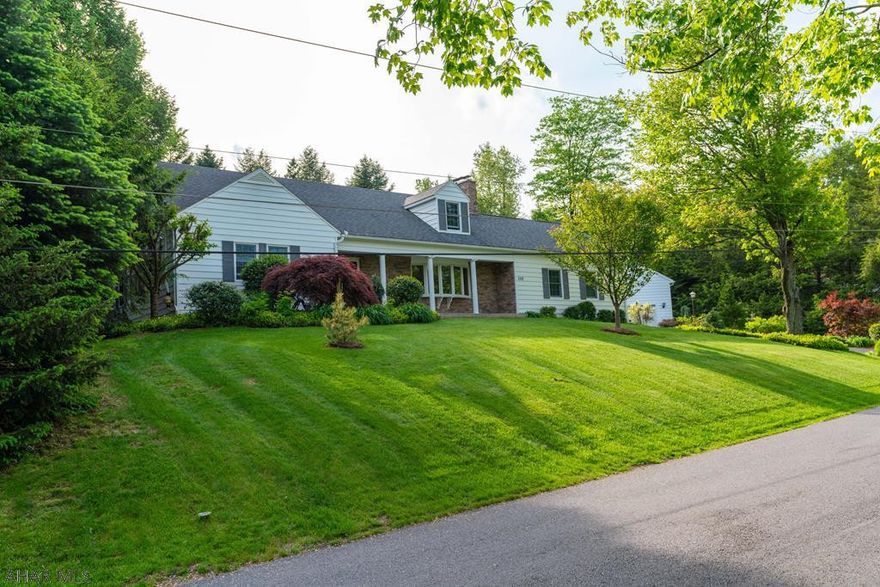 Spectacular, fully renovated  home  First Floor features ceramic and h/w floors, , living rm with  fireplace. Gourmet kitchen w/ granite c.tops and island, ss appliances, eating area off the kitchen, formal dining rm, bedrm, full bath and powder rm. 2nd floor  two spacious bedrms w/large closets and bath. The basement includes a full kitchen and  family rm.. Exit this beautiful home into a back yard oasis including an in-ground heated pool w/slider, diving board, waterfall, , A stamped concrete patio w/motorized shade and gas grill island complete this  tropical backyard. One car detached garage (24x30) with 2nd  floor storage and energy efficient solar panels to help heat the pool.Plus  an additional 2 car attached garage.Intercom  system, Rinnai on demand w.heater. Many more amenities.