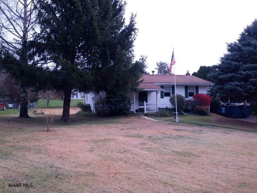 Location! Location! Location! Right across road from Canoe Creek State park's fishing and walking trails, also close to State Game Lands. 3-bedroom, vinyl sided home with modern kitchen and bath with ceramic tile floors. One car carport. 4 year old oil hot water baseboard furnace. Breakers. 2 pear and apple tree. #J-221