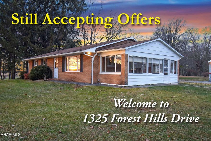 STILL ACCEPTING OFFERS on this 3 bedroom brick ranch on an extra large lot. A four-bay oversized former auto shop for all your storage needs or whatever your imagination can bring. A detached 2-car garage with an attached office/space. All on just over 2 acres in the Forest Hills SD. So many possibilities.