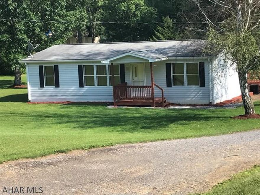 Kitchen renovated has island and laundry hookups. 2 car detached garage with gravel floor. Sectional home is on piers. Connected to public water and sewer. Driveway is a right of way, not owned by Holtz.