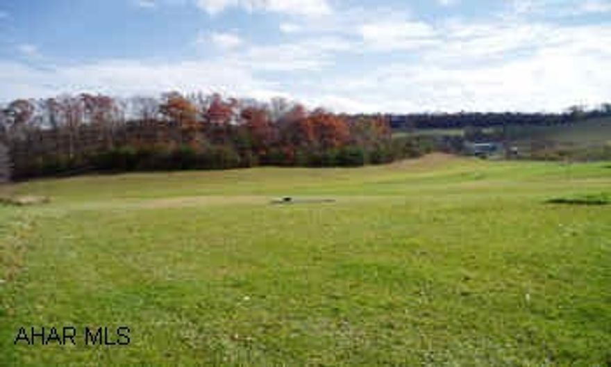 5.756 Acres if scenic rolling countryside with public water, sewer, electric, telephone and television all availalble