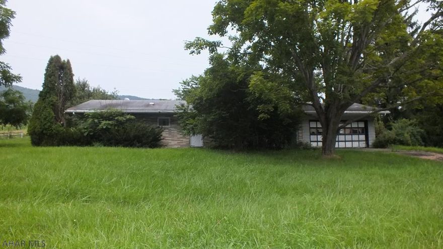 Saxton area brick 1 story on 0.48 acre lot in need of TLC. Large living room, kitchen, den with fireplace and basic bones are all here, but needs work and updating throughout. Nice area with first floor laundry, over-sized 1 car garage with workshop area, storage shed and more. Could be a great flip or investment property for handy-persons. Don't miss this unique one-of-a-kind opportunity. Call now! AS-IS sale. Seller will make no repairs.