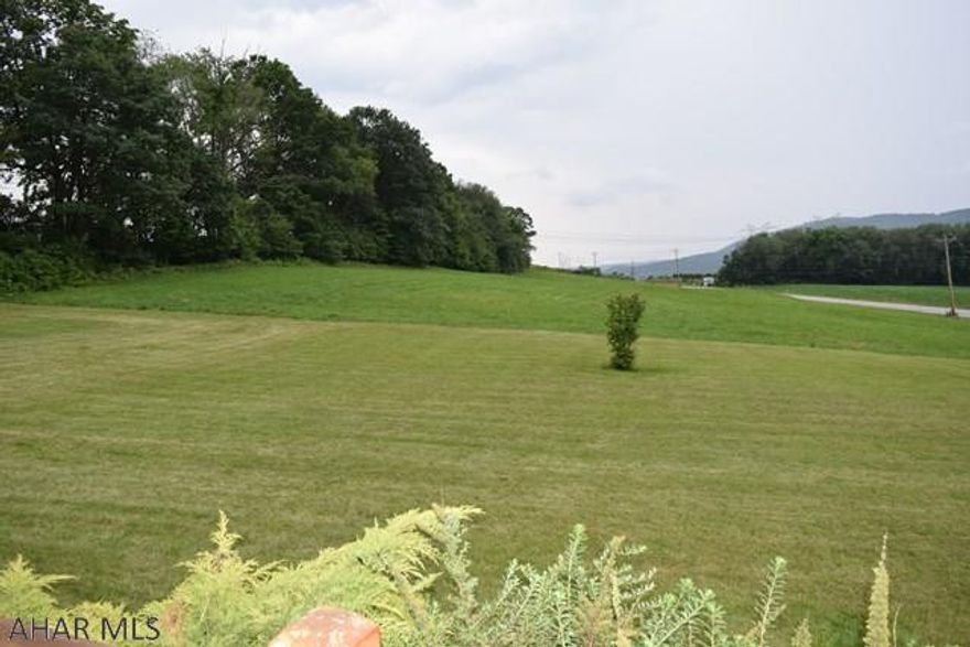 3.57 level acres that have been perk approved for three separate building lots and PennDot approved access to each if you wish to subdivide the property. Enjoy great mountain views across the valley. Centrally located and in close proximity to State College, Raystown Lake and Altoona. Cal listing agent for more details.