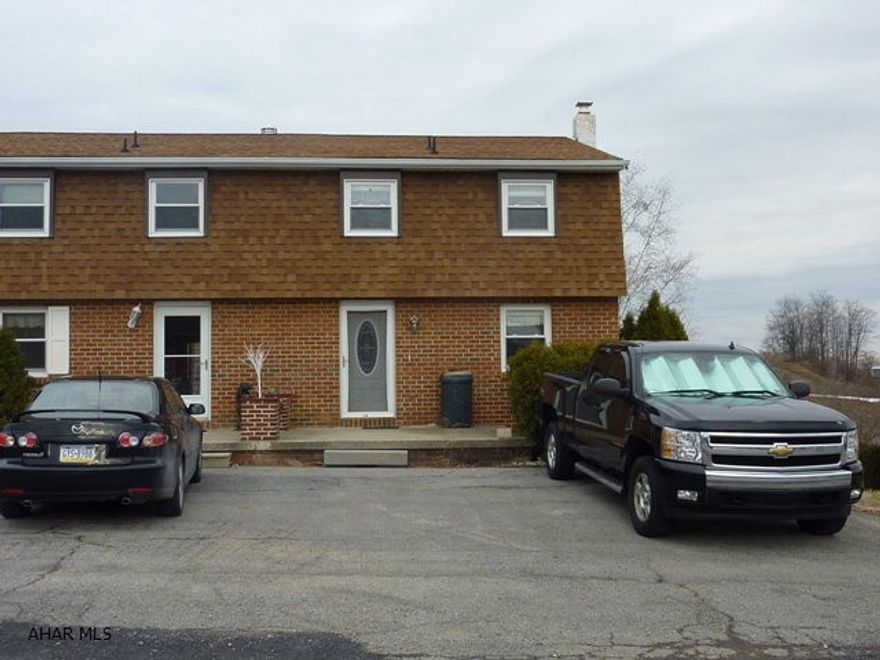 No association fee! Great opportunity for the first timer! Large living room with sliding door to large deck with a great view! Large family room, lots of storage. Fenced yard, patio.