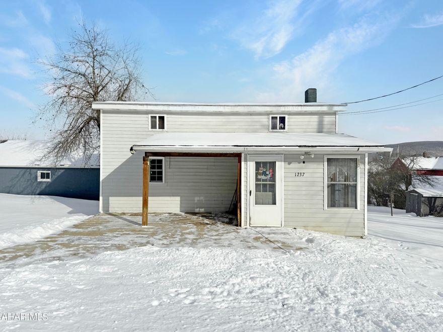 * Seller now offering a $5,000 credit to qualified buyers. * Welcome to 1237 Johnson Street, nestled within the Blacklick Valley School Districts. This stunning residence, positioned on a corner lot along a tranquil dead-end street, embodies the essence of serene living. The main floor boasts a delightful mudroom adorned w/ sliding glass doors, an expansive kitchen w/ ample cabinetry & counter space, a fully updated first-floor bathroom, a bedroom w/ a shower, a welcoming living room, & a dining area accentuated by a custom-built trophy case. Ascend the staircase to discover two generously proportioned bedrooms & a convenient half bathroom. While the basement remains unfinished, it offers excellent storage potential, housing your laundry & a versatile coal/wood/oil burning furnace. Come check out this move in ready home today!