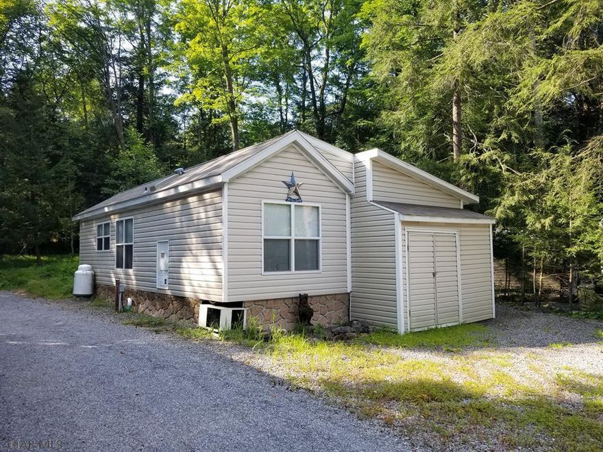 Beautiful! just like new 2010 park model camper on one lot inside Glendale Yearound. This park model has one bedroom and one bath, living room and kitchen. Looks like it just came out of the packaging. Has a covered deck and shed. Located in back of circle where there is a little more privacy. Glendale Yearound is a gated community located minutes from Glendale Lake and Prince Gallitzin State Park. Community pool, basketball, tennis, security, etc