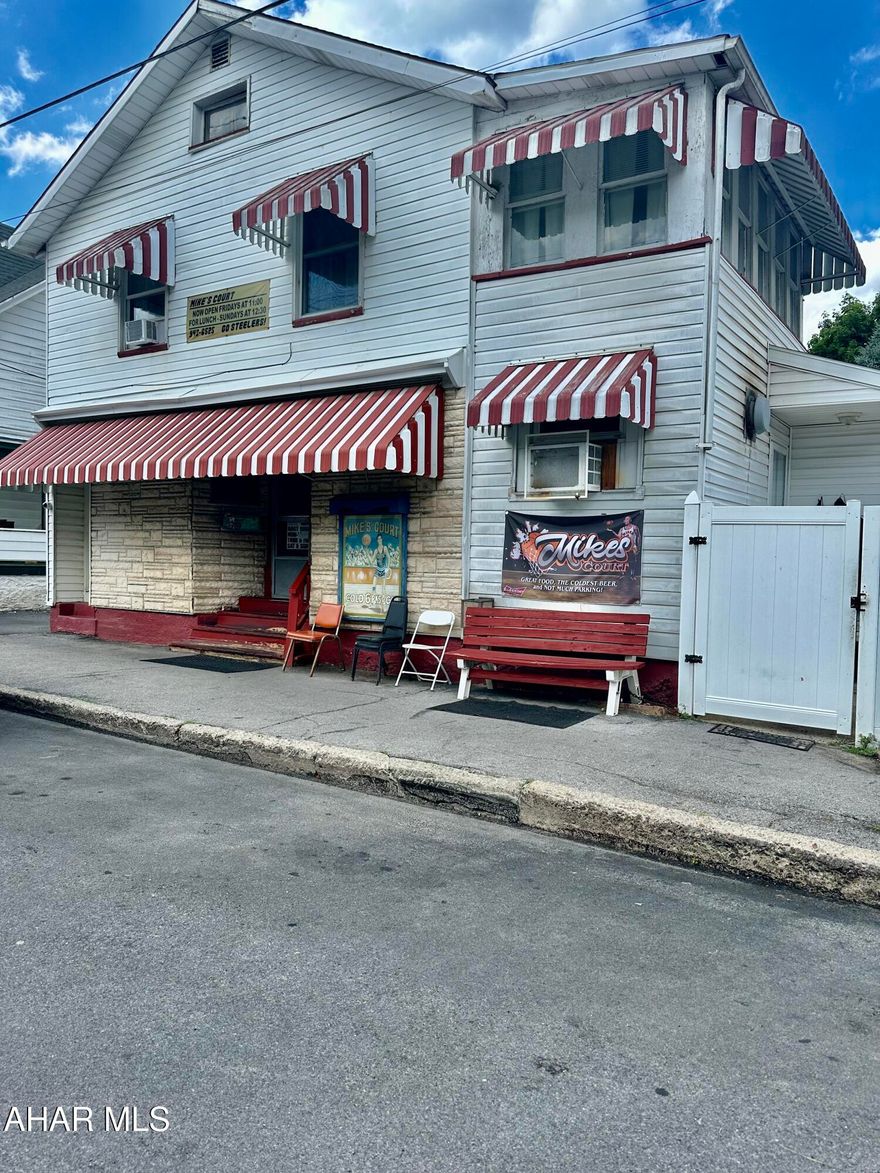 Have you ever dreamed of owning your own Bar/Restaurant? Mike's Court Sports Bar is one of the last neighborhood bars left in the city. This iconic bar/restaurant offers a beer license, indoor and outdoor seating, skills game of chance and a spacious upstairs apartment for the owner to reside in or for extra income. This turn key operation includes the building and the business. There are also 2 additional properties that could convey if buyer is interested in additional rentals/income.