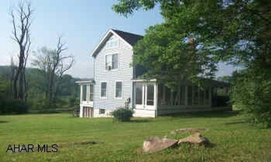 Beautiful remodeled farmhouse on 1.2 acres.  Some furniture included in sale. Call office for details.