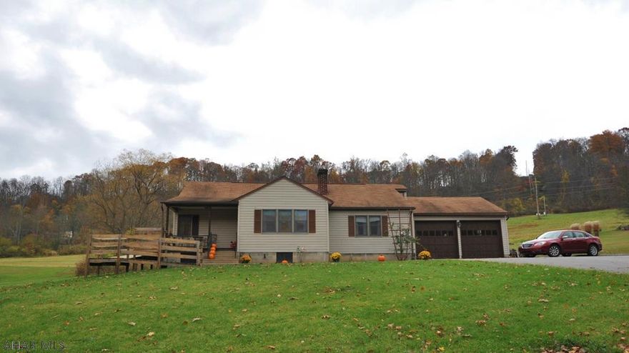 Charming 3 bedroom 1  bath ranch located only minutes from downtown Hollidaysburg.  This is the perfect house if  you are looking for a country setting, yet want to be close to everything in town!! Cozy living room features a fireplace and hardwood floors!  The kitchen has a breakfast bar giving you plenty of counter space for preparing meals!  Attached to the house is a FOUR bay garage!! Will not only make a great place to park your cars but plenty of room for all your toys and great room for a workshop! Schedule your showing today!! Priced to sell quick!!! Buyer to confirm tax,sq feet and lot size.