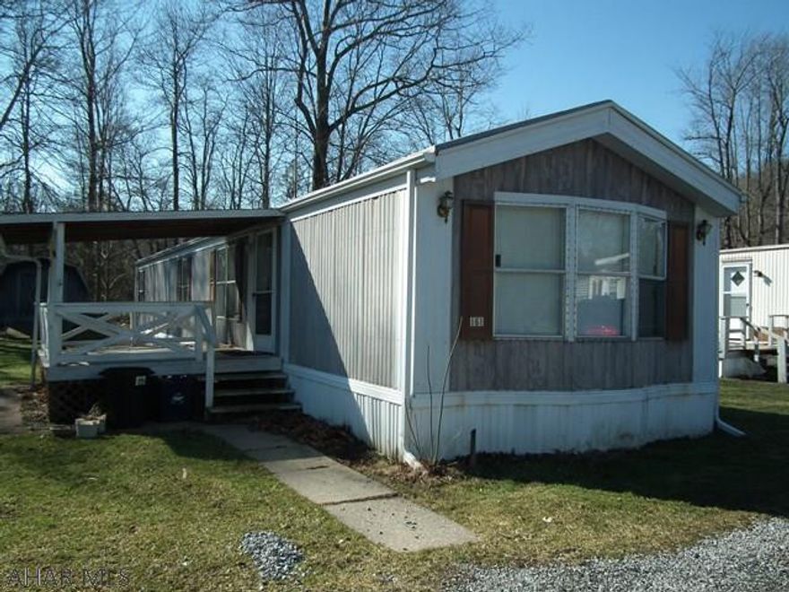 Great starter up home, newer carpeting, island in kitchen, covered porch, shed. Close to school.