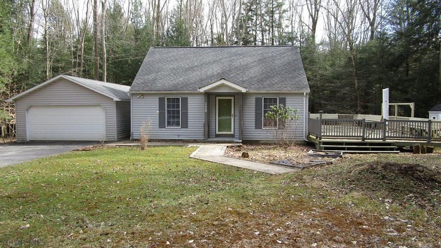 This is the little house that could - be your next home or getaway.  Don't be deceived by looks.  This home gives the appearance of being small on the outside but inside is a two bedroom home with a kitchen boasting stainless steel appliances and a living room. The gas stove helps to keep you cozy warm in winter.  Ceramic tile floors. Hook-ups for a stackable washer and dryer in the first floor bathroom.  Upstairs is a half bath with capabilities to add a tub/shower.  The second floor is unfinished but offers the opportunity for an expansive master suite or two additional smaller rooms.   Relax on the huge deck w/ built in benches and watch the creek and wildlife in the woods out back.  Two car garage.  Seller is giving a $650. credit to the buyer for staining the deck to their preference.