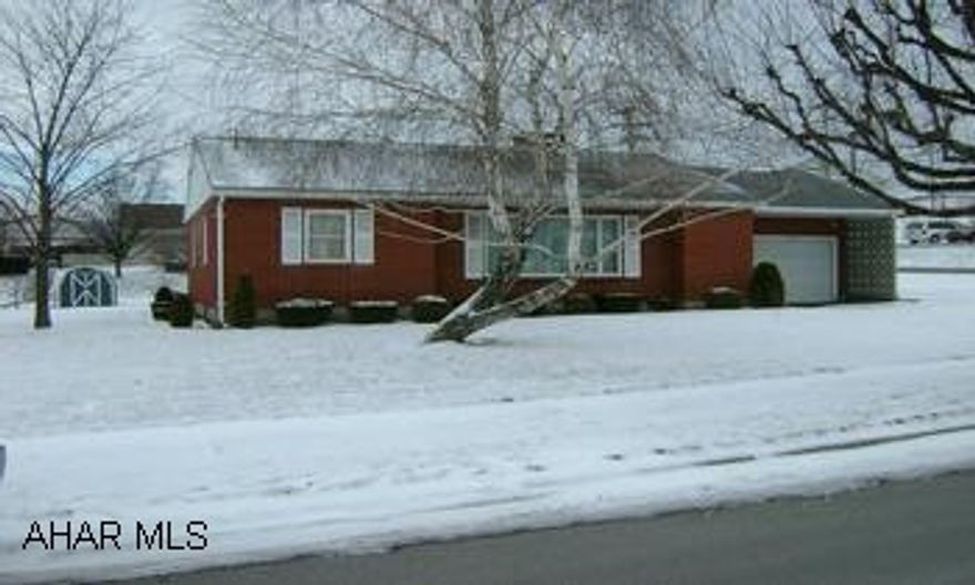 Great brick ranch three bedroom home on level double corner lot. Hardwood floors. One car attached garage. Close to banks, stores, restaurants, hospital, and pharmacies.  Patio and outdoor shed. Central air installed in 2005. 1000 gal oil tank under  drive way