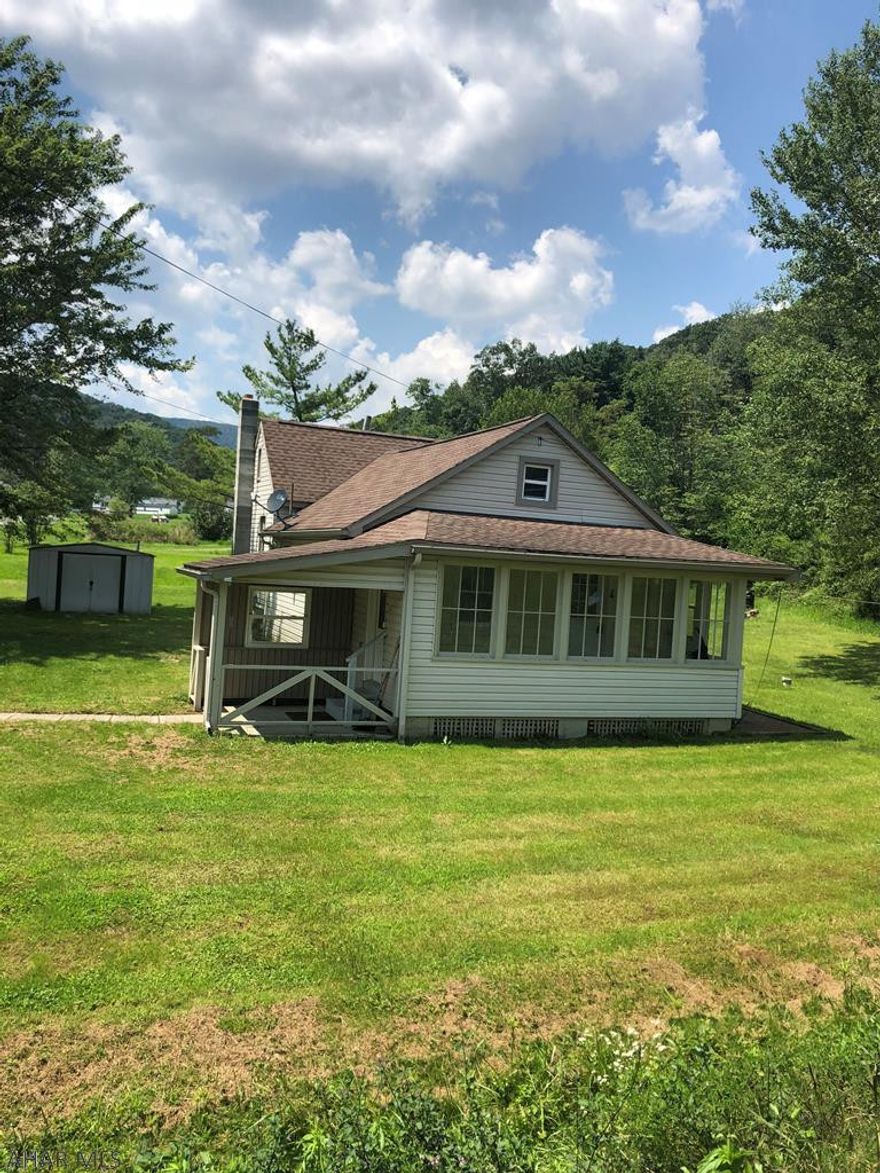 Cute 2 BR starter home on an almost 1/2 acre flat lot, nice country living, yet so convenient to I-99 and shopping.  Nice enclosed Sunroom/Porch area, hardwood floors, eating area off kitchen....Call Listing Agent for an appointment...May not last!