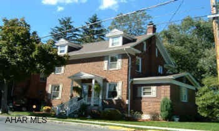 Wood burning fireplace in living room - recently used.  Wall unit air conditioner cools 1st floor.Within walking distance to all schools and YMCA. Laundry in basement.  Washer/dryer included.Great eat-in  island in kitchen. Beautiful 2 story brick home, corner lot on Garber Street in Hollidaysburg. Great neighborhood.   Home in excellent condition. New kitchen with new appliances  included. New roof, new plumbing, new windows, c. tile floor. Spacious living room.  Large screened-in back porch with hot tub (negotiable). Partly finished room on 3rd floor.