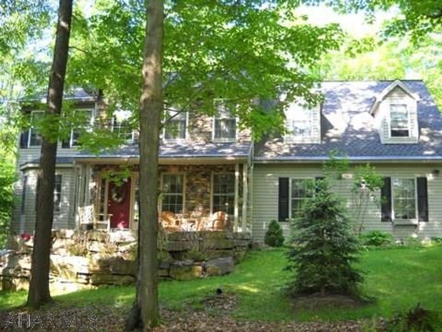 Exceptional 2 story stone and vinyl home on large landscaped lot. Custom quality throughout. Lots of updates. Beautiful wood floors. Plain and fancy custom kitchen. Oversized 2 car garage.