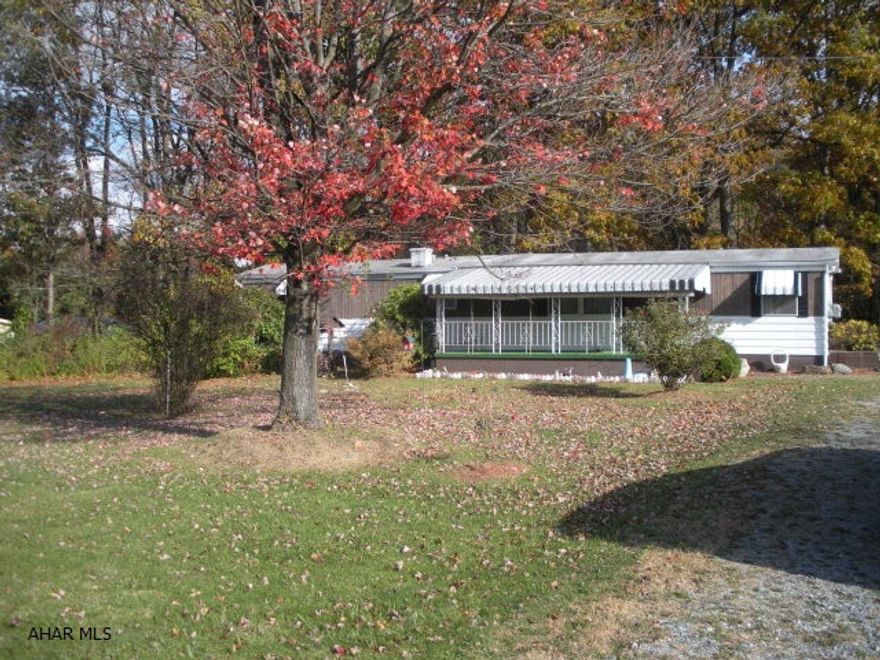 1967 Holiday Cottage 2 bedroom singlewide mobile home (63x12) on nice lot in Logan Township. Property is irregular shape with 250 feet of road frontage. Includes 2 car detached garage. Low taxes. Sold AS-IS.
