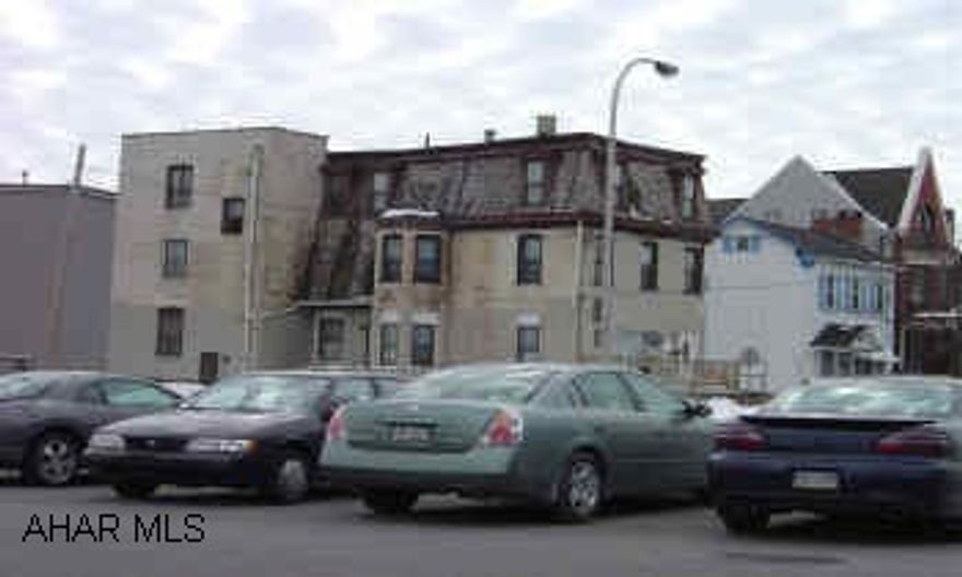 3 unit brick. Renovated mid 80's. All separate utilities including water & sewer.