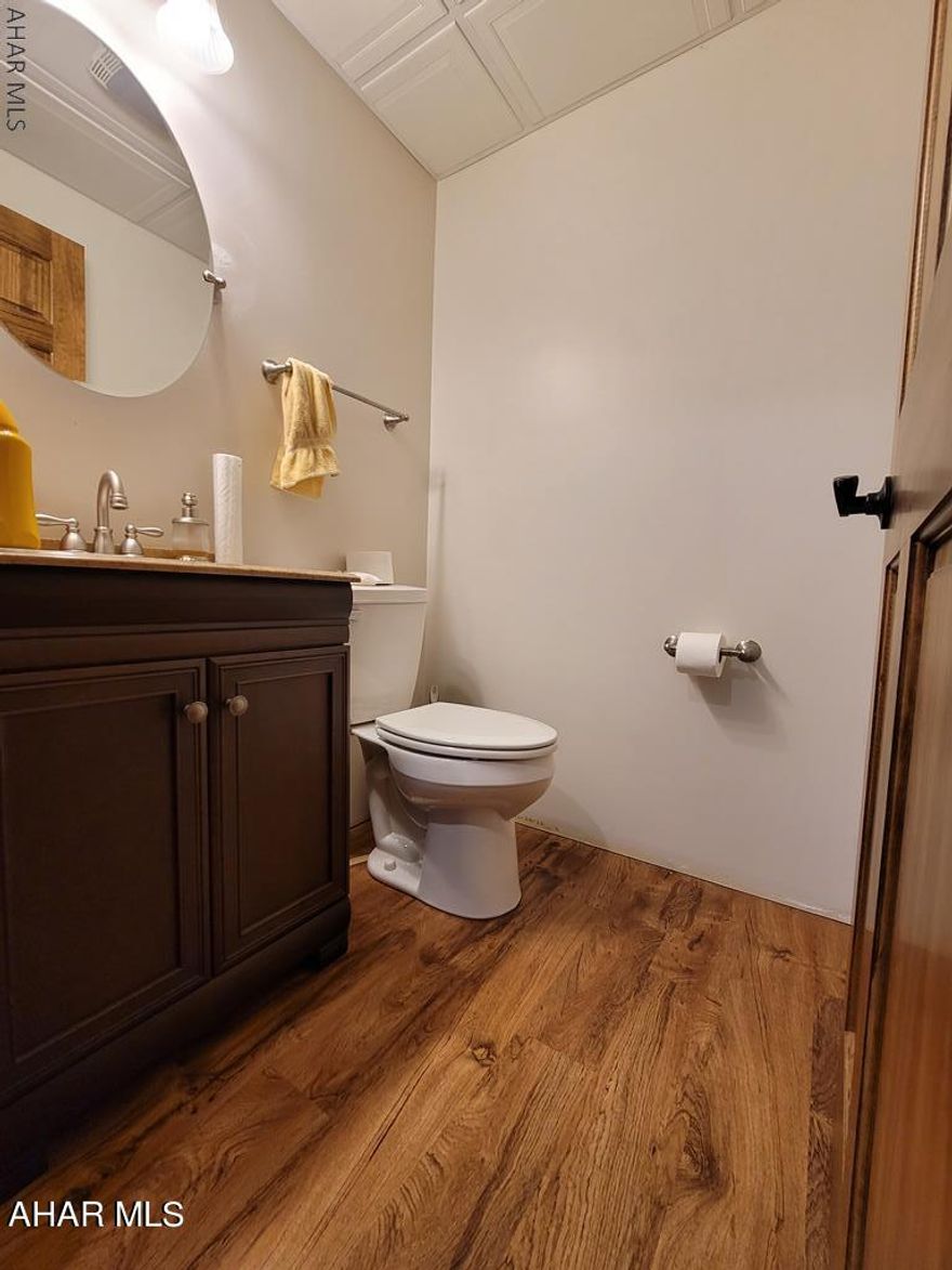 This beautiful, completely custom built multilevel boasts an open floor plan, 3-4 bedrooms and large family room. Enter the front door to a beautifully open living room and kitchen offer warm hardwoods that welcome you in as the vaulted ceiling expands the space. Enjoy watching wildlife out the large front windows or off the back deck. Each of the 3 bedrooms have solid wood doors, closet doors that top high quality carpet. The master bedroom features a convenient walk in closet and master bath with walk in shower and hand crafted vanity. The lower level family room is trimmed in beautiful wainscoting over carpet with an abundance of natural light from the windows A convenient 1/2 bath, workshop and laundry room. Oversized 2 car garage, the privacy is unmatched on the wooded 10.6 Acre lot! Private Remarks: Some notice, must be confirmed. $400/year Homeowner's Association fee is for road maintenance paid to Hickory Ridge