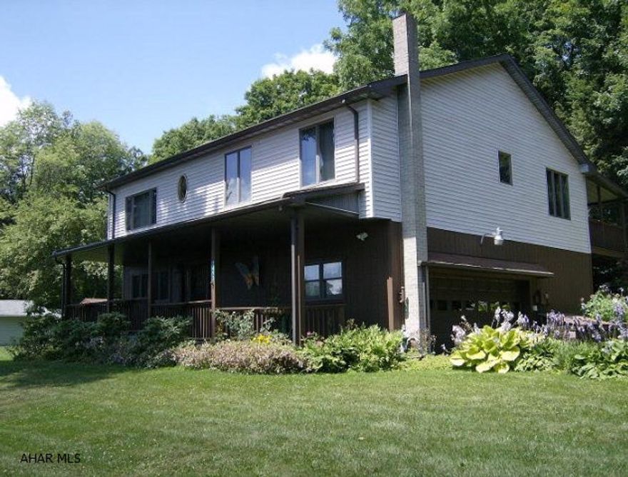 2 story, 2 BR, 2 bath vinyl sided home on a well landscaped  0.5 acre lot. Oak hardwood & ceramic tile floors, as well as carpeting. Oil HW heat & hard coal/wood stove (which could be primary heat source) Large front & back porches. 2nd floor covered deck with access from Family room & master bedroom suite.