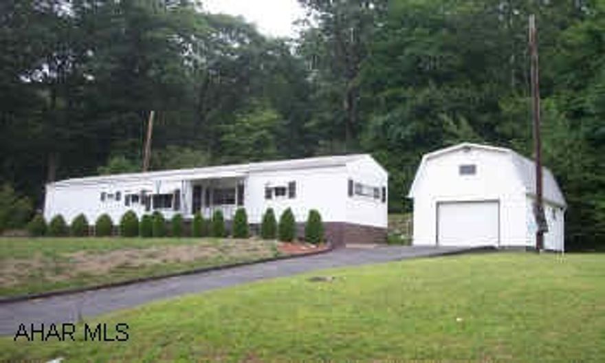 Immaculate and well-maintained single-wide on owned ground on Reservoir Road. Large family room addition, detached and heated garage w/attic storage. New water heater, furnace, and all appliances included.