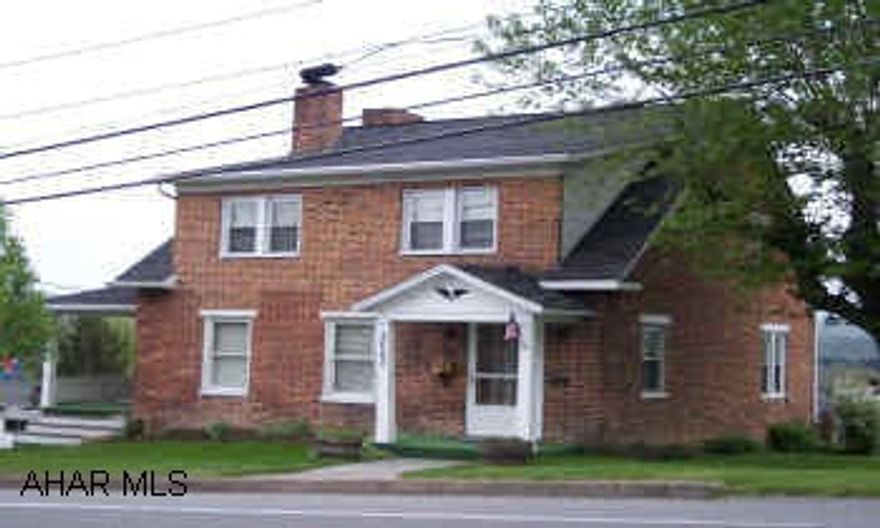 Well kept brick home features beautiful oak trim and hardwood floors large living room and fireplace with pellet stove insert