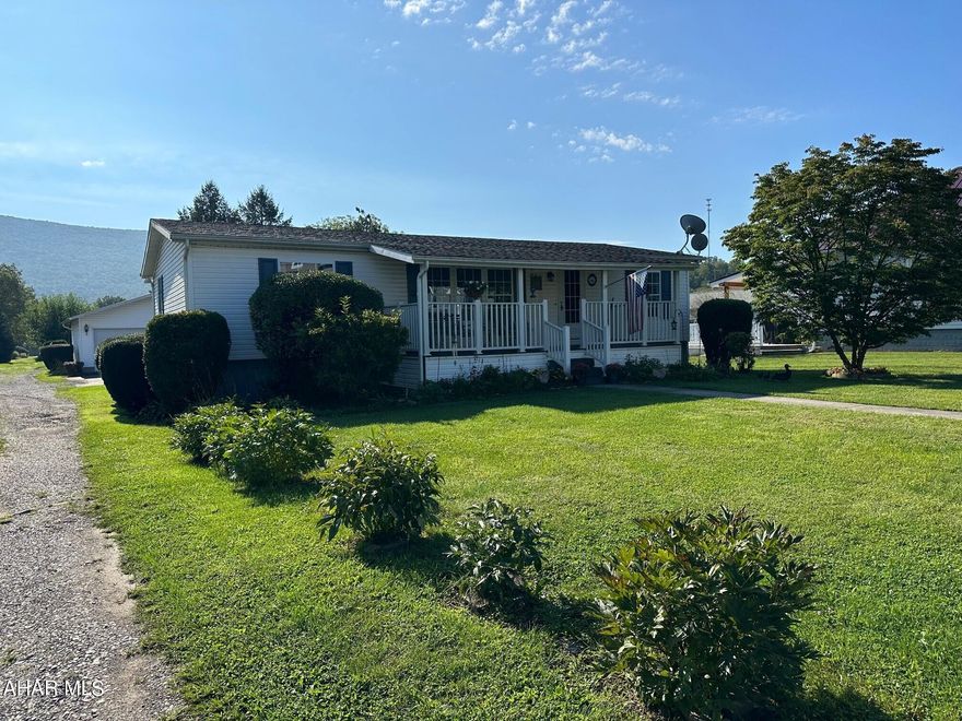 Easy living and maintenance in this one story home with two porches and a large two car garage.  Well landscaped level lot.