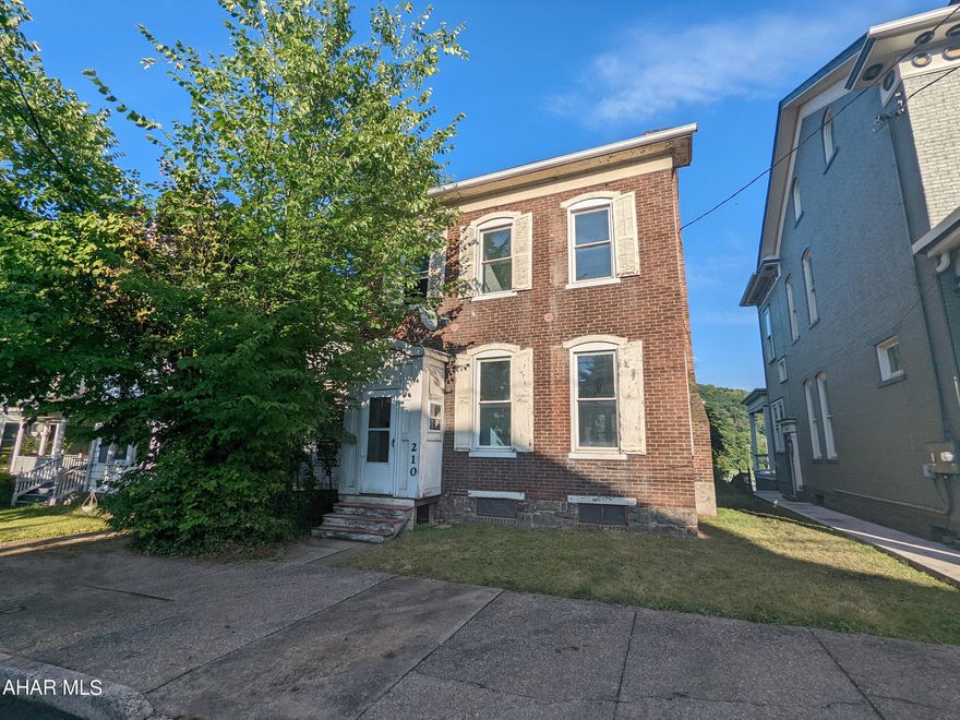 Huntingdon Borough 2 story brick historic home will spark your imagination. Large living room with dining room combo, kitchen with adjacent bright sunroom and 3/4 bath all on first floor. There is also a room roughed in for possible 1st floor laundry.  3 bedrooms, 1 bath upstairs and loads of possibilities throughout. AS-IS sale, seller will make no repairs. Underground oil tank on property.