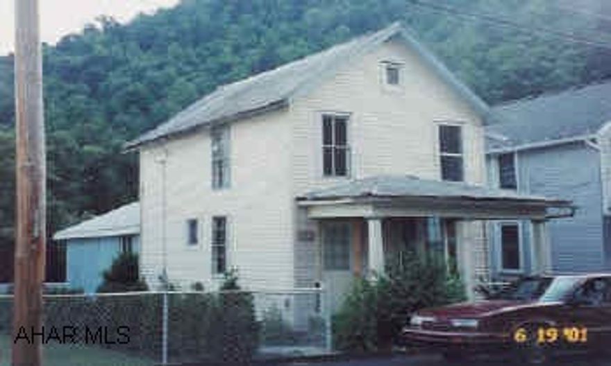 Two-story frame with 3 bedrooms.  Fixer-upper/rental.