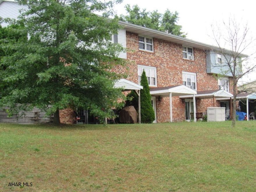 Great Townhouse with walk out basement to covered patio with a nice view! All new replacement windows and doors. Move-In Ready, freshly painted! Easy maintenance, 2 parking spaces and NO HOA Fees! Close proximity to stores and shopping!