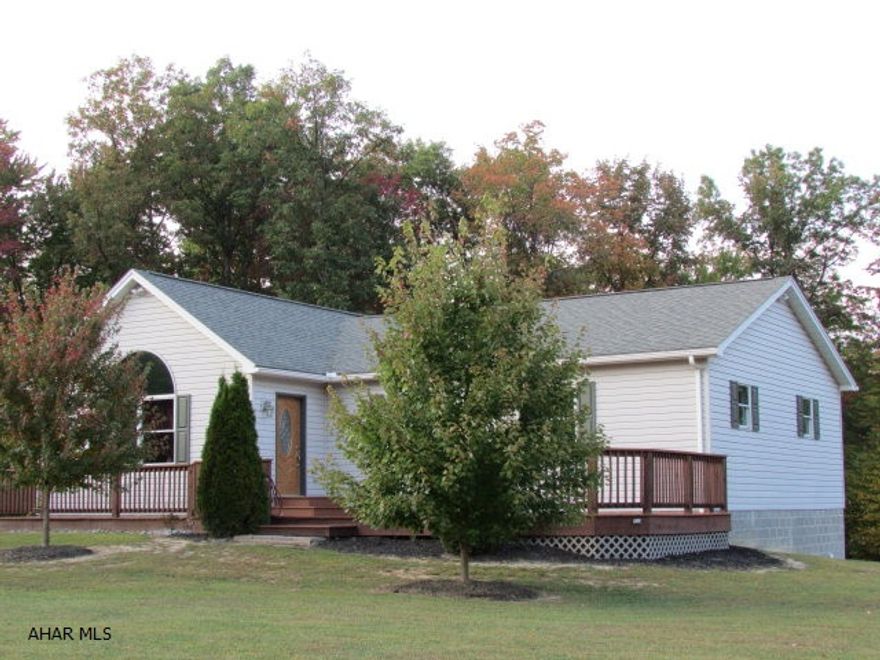On 3.47 ACRES! PLUS - A STONE'S THROW FROM MASSIVE STATE GAME LANDS! AND you have to see the inside of this home!! The LR, kitchen and dining area are an open floor plan. The ceiling is vaulted w/poplar wood, plus pendant & recessed lighting. The LR has hardwood maple floor, large rounded window at front, & built-in entertainment unit. The kitchen and cook stove have marble floor, light maple cabinets & boasts large WIC & pantry. Three bedrooms-all have large closets of hanging & shelving; maple floors. Full bath has ceramic tile. The downstairs is great w/office area; bonus room that you enter through French doors; a 26x26 family room w/kitchenette, torchiere lighting at corners, wainscot. Beautiful 3/4 bath off FR. Really low utilities. 42x6 deck on left side plus 28x16 deck at front!