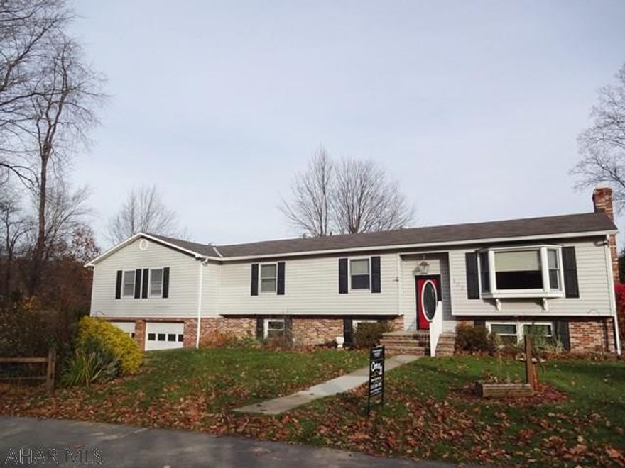 Very spacious - oak kitchen, dining area w/oak cabinetry and garden windows. 4 bedrooms, family room w/ kitchenette. Great room in the basement w/ fireplace. 2 car garage nice big rear deck. One the end of a dead end street. A must see!