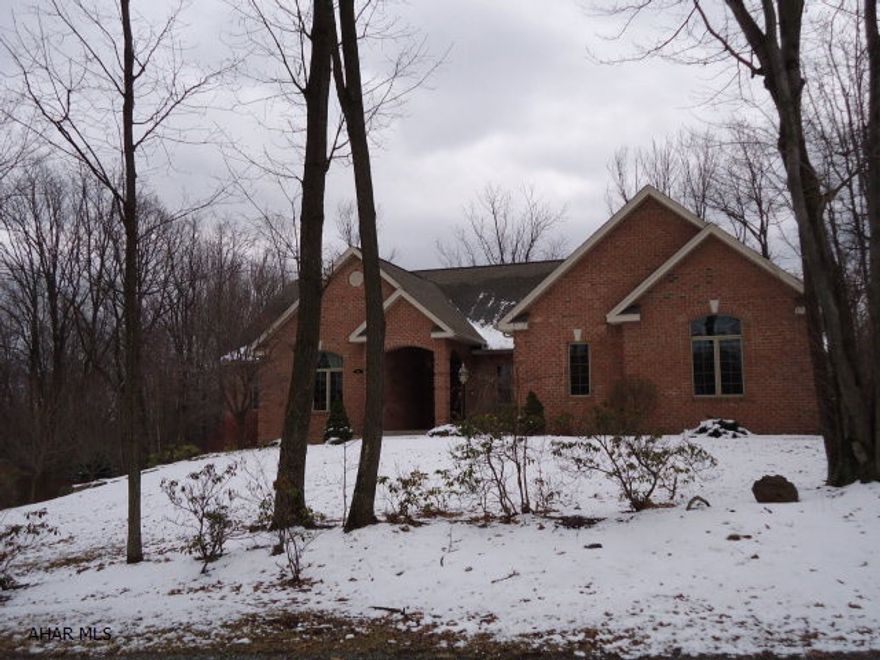 Fabulous Home with a view of Iron Masters Country Club. Vaulted cielings in living room with built in gas fireplace. Custom cherry kitchen with walk in pantry, cozy sun room with wood burner. Hardwood and tile floor throughout. Master bedroom with two walk in closets. Deck with hot tub off master bedroom.