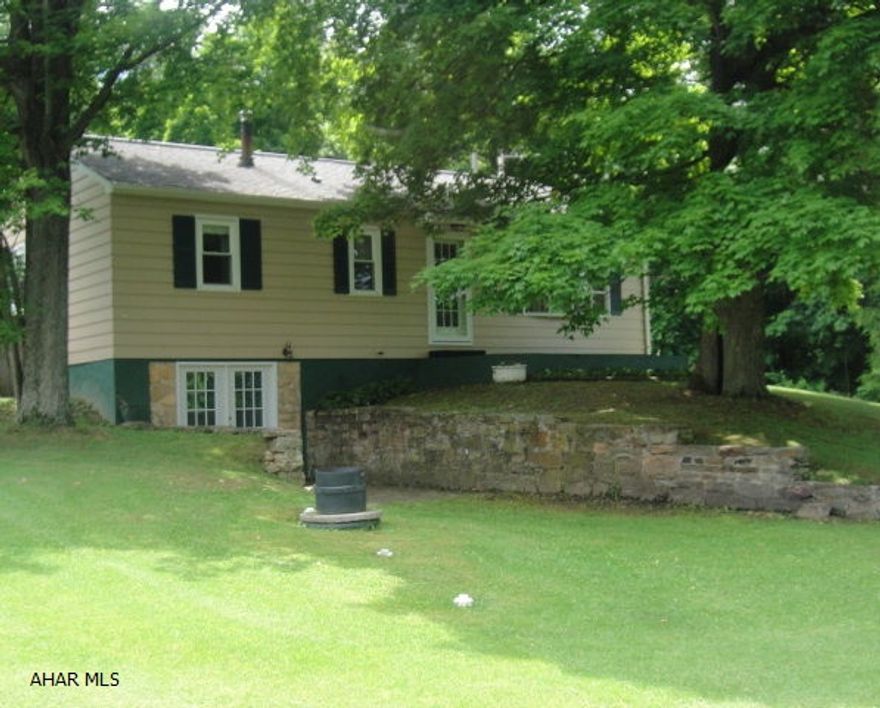 Exceptional home close to amenities with a rural feel. 3 bedrooms, 2 baths, covered 10x24 country porch and total privacy in the backyard oasis that includes swimming pool, outdoor fireplace, campfire pit, horseshoes and more. Finished basement with 3/4 bath, French doors that walk onto brick pavers. 200 amp electrical, newer windows and roof, economical to heat. Large 32x36 garage, fully insulated with separate 220 volt circuits. Well maintained and ready to move in!