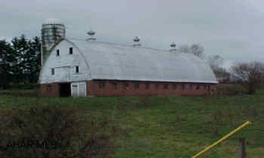 Brick Barn +12.9 Acres House is in Borough of Hollidaysburg. Both House & Barn Need TLC. All 5 Parcels being sold as one  property for $1,400,000.