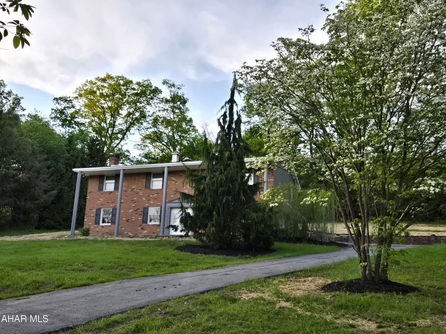 3-bedroom, 2-bath home w/Sunroom, finished basement, 2-car garage + blacktop drive. New vinyl siding, windows, doors, flooring, composite deck, heat pump/air conditioning, landscaping + 2-year old roof on beautiful 1.21-acre private setting with great view. J-664