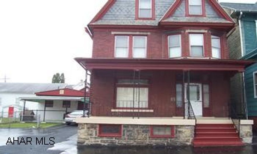 Two refurbished houses on a double lot.  Both move in condition.  Back house has central air, new roof and all appliances stay.  Two car garage with workshop. Live in front house and pay for your mortgage by renting out the back house.  Great income potential.