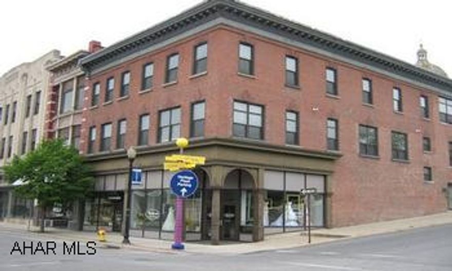 3 Commercial spaces & 7 apartments. Tenants pay all utilities but water/sewer. Nicely updated building. Great investment opportunity.