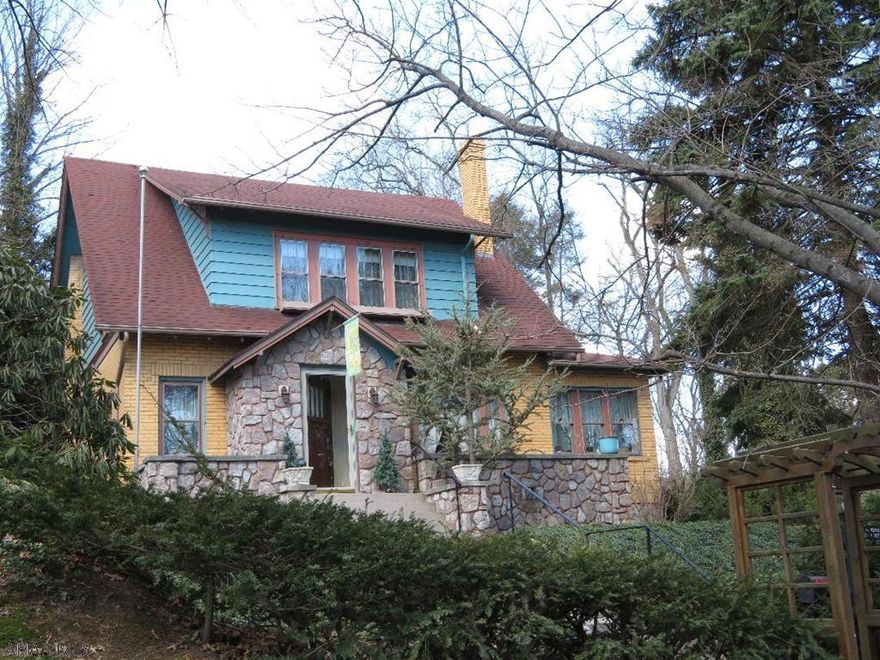 Charming Brick - Corner Lot with 3BR, New BA, foyer/closet, LR wood burning FP and built in shelves, 9' beamed ceiling, Dual staircase to landing, kitchen has granite counters & breakfast bar, 2 pantry cupboards, kit appliances & track lighting, formal DR has patio doors to deck, sun room has built in shelves with mirrored wall.  Second floor BR's with w-in closets and New bath, hall linen closet, fin. attic with storage.  Basement partially fin. with exercise or recreation area, laundry, utility sink, workshop, utility room with two heat sources gas OR wood/coal boiler.  Other features include hardwood floors, crown molding, deck, terraced yard, garden, perennials, patio, shed, gazebo, 2-car(24x24) gar w/8' doors, gas, electric and water, cement drive off 32nd St.  Taxes $2253 yr