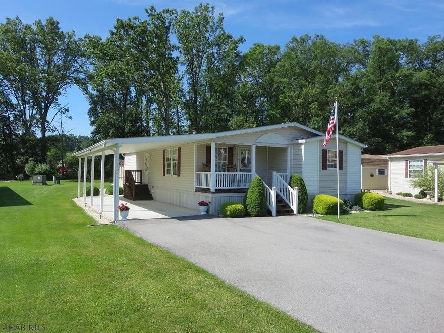 Very nice double wide in popular Friendship Village. Kitchen/dining includes built ins and slider to deck. Carport covered deck, Esh's shed. Includes appliances, window treatments, ceiling fans, central a/c. Lot rent is $240 per month. Buyers must be approved by park office.