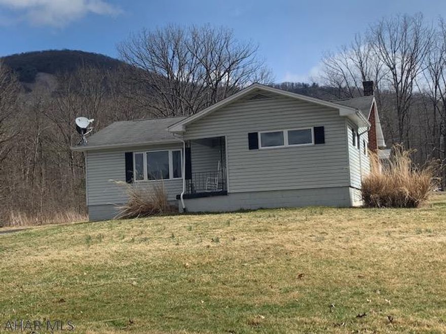 One story living on flat lot with large carport. This home is ready for a new owner with new flooring, freshly painted and new kitchen. Country living but close to town.