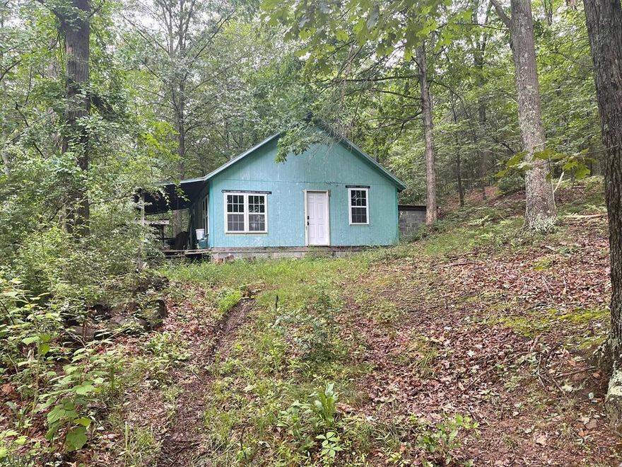 5.5 +/- Wooded acres with a small seasonal stream and a cabin in need of TLC located not far from PA State Game Lands. Property is being sold AS-IS and will need to be a cash sale only.