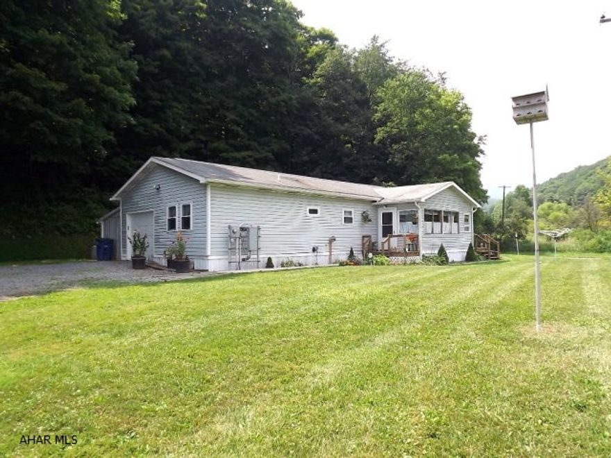 Spacious and well maintained ranch-style house on 1.7 acres! Entire home remodeled in 2012. Beautiful kitchen with high-end appliances, wood laminate throughout, enclosed porch, newer windows, 40'x30' pole barn and stream. A great buy!