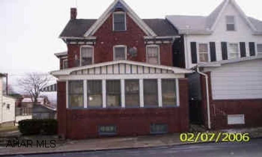 2 1/2  story brick on double lot. Sold "AS IS". Buyer to pay 2% transfer tax.