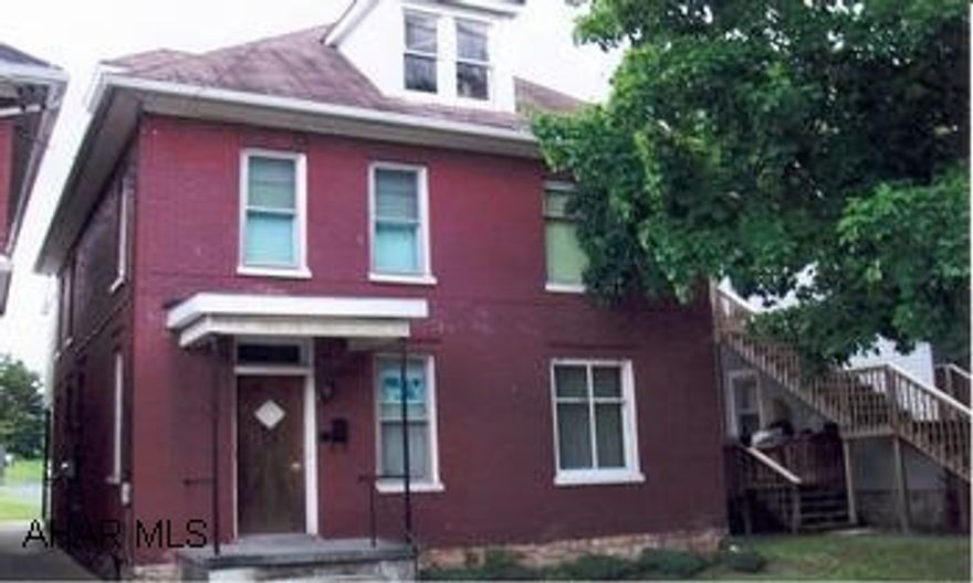 All brick single family home converts to duplex in a snap. Eat-in kitchen on each floor, fireplace, large rooms. Full basement, oak woodwork, extra large covered back porch, large lot, walk-up attic.