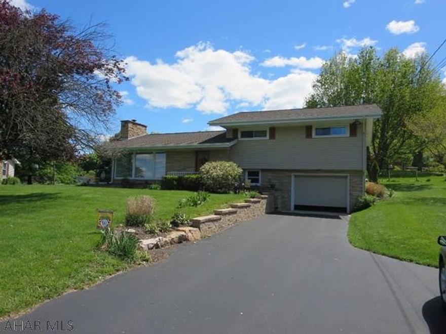 Very nice, updated split level located in the desirable Meadowbrook Terrace neighborhood. Large living room with hardwood floor and fireplace. Updated kitchen features, granite countertops and stainless appliances (all included). Lower basement has an extra large family room with fireplace and built-in desk. Enter 12x 30 sunroom from either the dining room or kitchen and enjoy the included hot tub. Your choice of heat pump or oil furnace and heat/AC wall units. Most definitely this one is move-in ready.