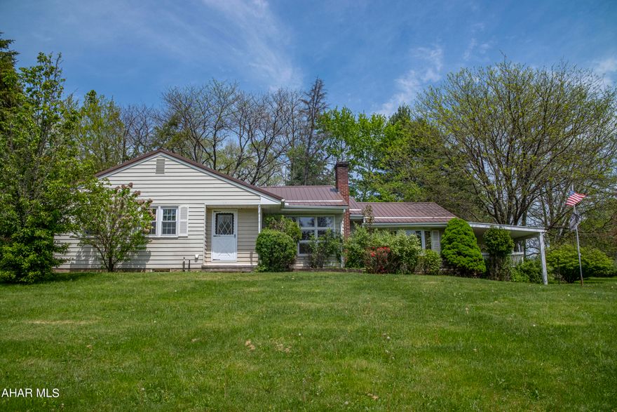 Highly motivated sellers. This one-story home is located on a large corner lot in the Riggles Gap area, within the Bellwood Antis School District. It features an updated, eat in kitchen with plenty of cabinet space. Appliances have all been purchased within the last couple years and are in ''like new'' condition. There is a separate dining room off the kitchen with beautifully finished hardwood floors. The large living room has a sliding door that leads to a covered deck, perfect for entertaining. There are 3 bedrooms. One of the bedrooms is currently being used as a laundry room, however it can easily be converted back to a bedroom. There are washer and dryer hookups in the basement as well. This property also has an oversized one car garage and central air. A new metal roof was installed in 2018. There are hardwood floors under the carpet in the bedrooms just waiting to be uncovered!  Call today to schedule your private tour!