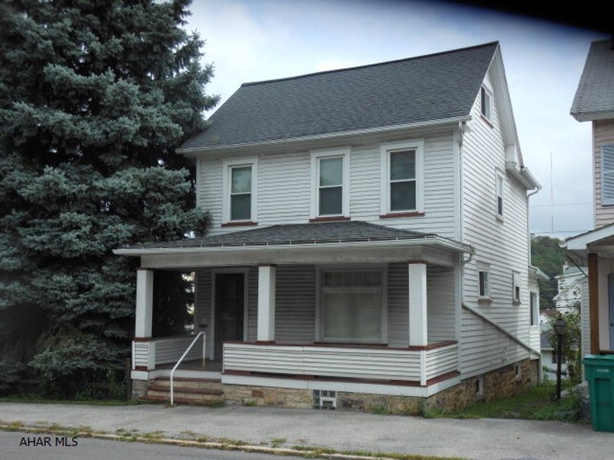 Well built 2 1/2 story vinyl sided home on a double corner lot. Off street parking and one car garage. Updated windows, heat and electric. Three bedrooms, dining room, large living room. Attic and basement storage.