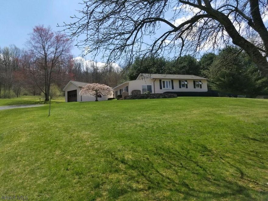 This meticulously kept ranch home sits on approximately 1 acre with stunning mountain views! The home has 2 bedrooms, 1 bath,  and a finished basement. Other features include a 1 car detached garage, shed, and heated sunroom. Enjoy time on the front patio watching the sunset, or on the back patio in the hot tub! This property is within close proximity to Lake Raystown which is approximately 12 Miles away!