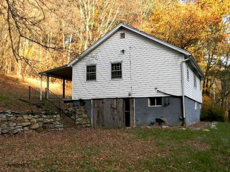 Small ranch type house, barn and additional structure on 9+ open acres. Surrounded by private woodlands. Selling AS-IS.